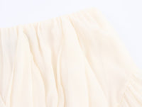 Rock mit verspielten Falten